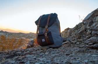 walking rucksack sitting on a mountain top