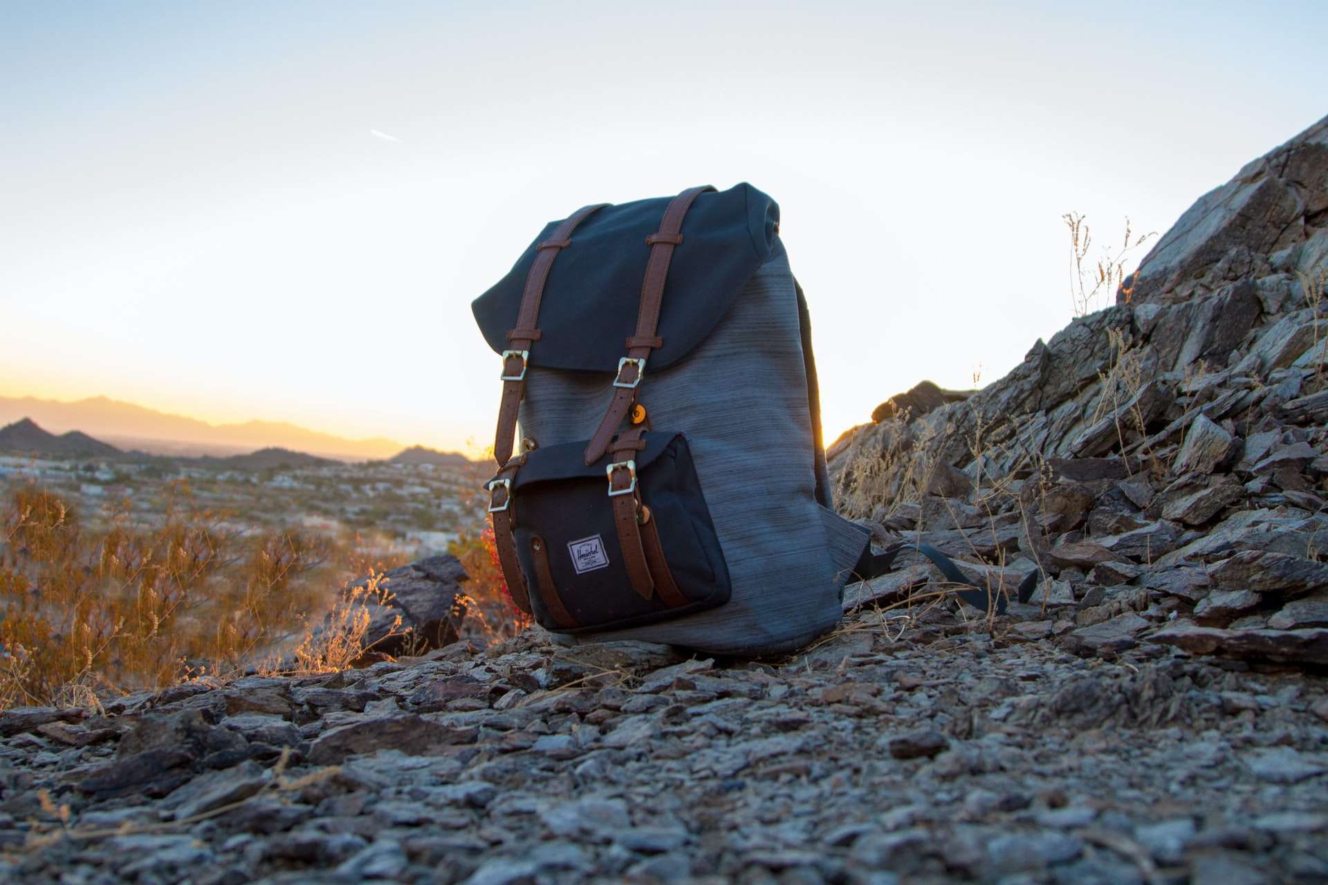 walking rucksack sitting on a mountain top