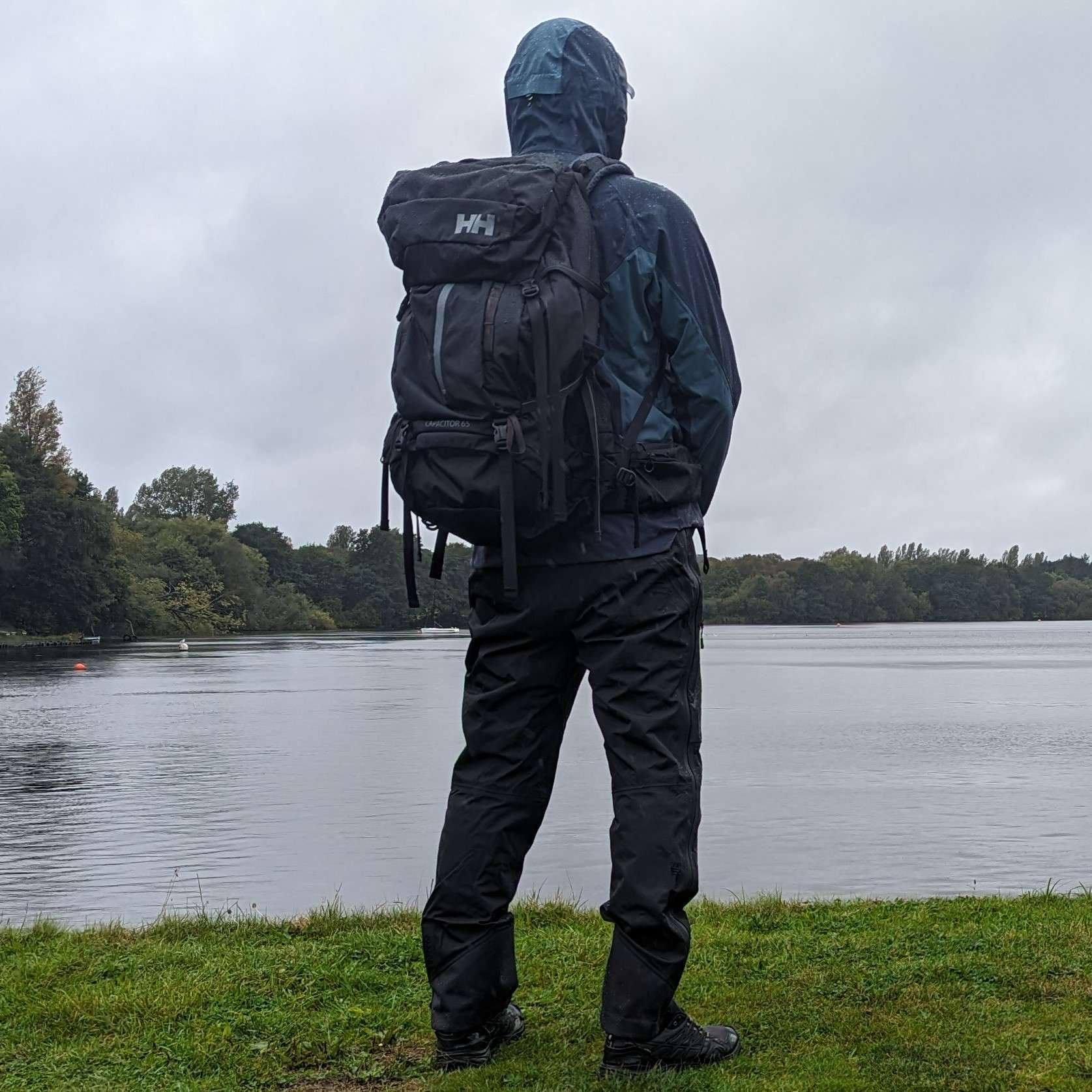 Man standing in the rain with Decathlon Quchua waterprrof jacket MH500