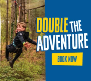 a boy on a zip wire at go ape adventures