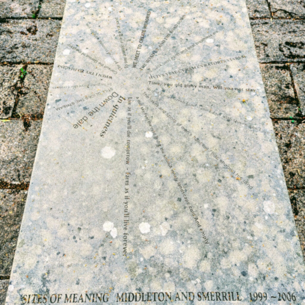 a slab of stone with an enscription on it