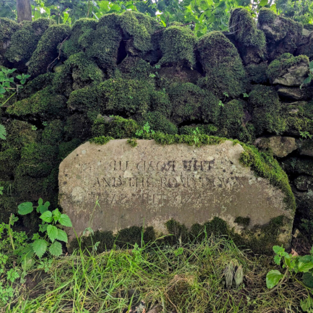 a stone tablet with some text carved in to it