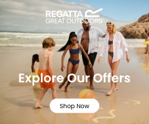 A family in outdoor gear playing on a beach
