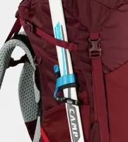 red rucksack closeup of walking pole attached