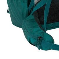 a close up view of a hip belt pockets on a green rucksack.